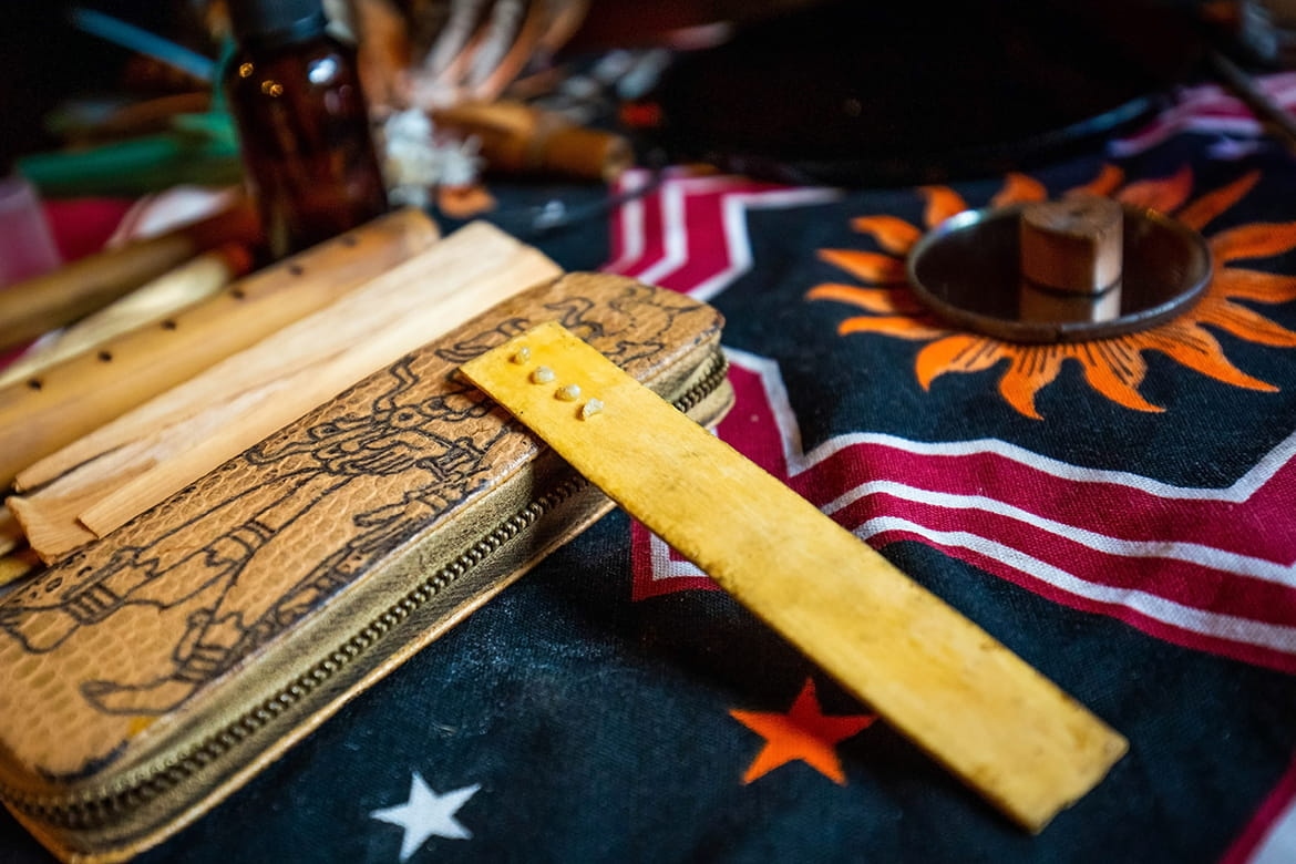 Kambo ceremony tools — wooden applicator and sacred textile